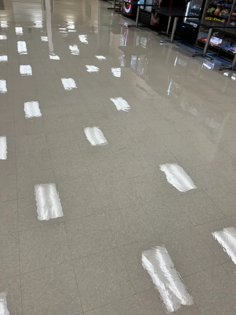 High-gloss commercial tile floor after professional strip and wax service
