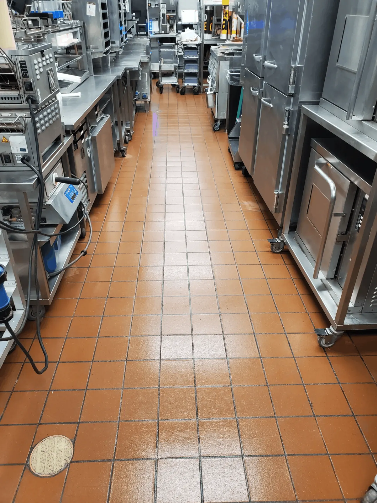 Commercial kitchen quarry tile floor cleaned and degreased to a like-new finish