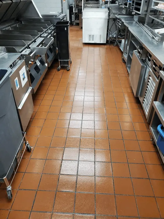 Restaurant kitchen tile and grout cleaned to restore original color and shine